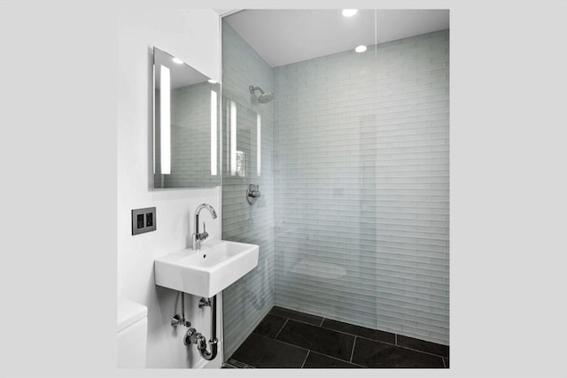 5 Willow Ave, Somerville, MA 02144 - bathroom with toilet, tiled shower, recessed lighting, a sink, and tile patterned flooring