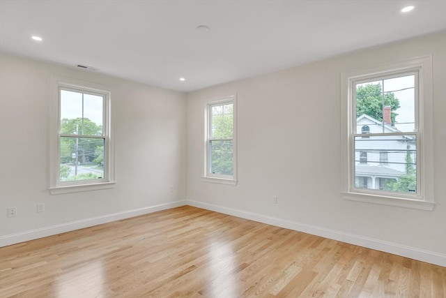 38 Green St Unit 38, Watertown, MA 02472 - empty room featuring light wood-style flooring, baseboards, and recessed lighting