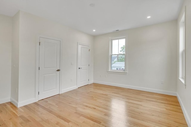 38 Green St Unit 38, Watertown, MA 02472 - unfurnished bedroom featuring light wood-style floors, baseboards, and recessed lighting