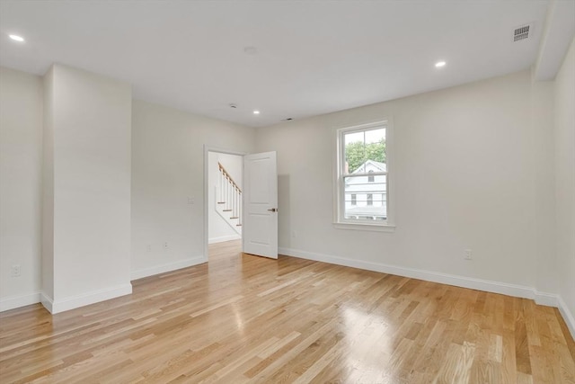 38 Green St Unit 38, Watertown, MA 02472 - unfurnished room with light wood-style flooring, stairs, baseboards, and recessed lighting