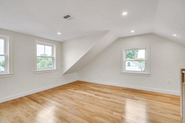 38 Green St Unit 38, Watertown, MA 02472 - additional living space with light wood finished floors, vaulted ceiling, baseboards, and recessed lighting