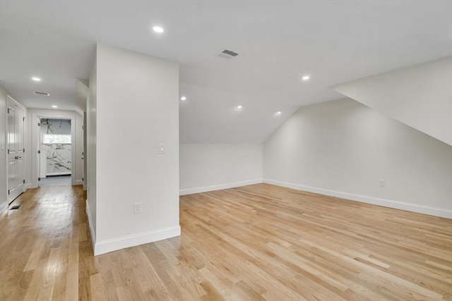 38 Green St Unit 38, Watertown, MA 02472 - additional living space with light wood-style floors, vaulted ceiling, baseboards, and recessed lighting