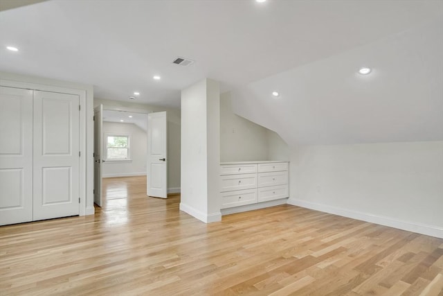 38 Green St Unit 38, Watertown, MA 02472 - additional living space with light wood finished floors, baseboards, vaulted ceiling, and recessed lighting