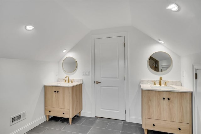 38 Green St Unit 38, Watertown, MA 02472 - full bath with lofted ceiling, two vanities, tile patterned flooring, and baseboards