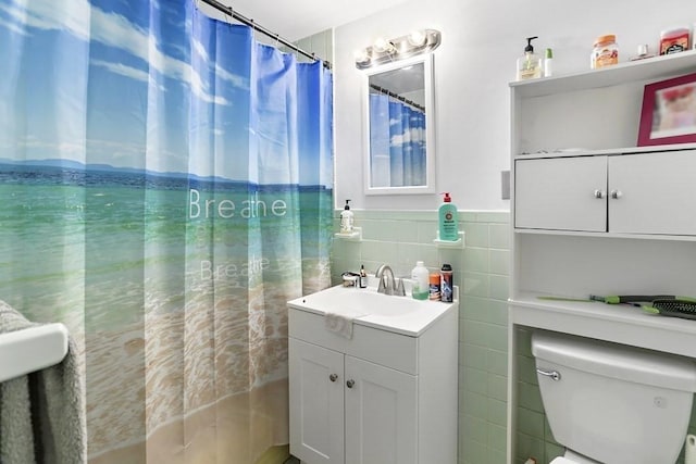 74 Beach St Unit 1-3, Woburn, MA 01801 - full bathroom with tile walls, vanity, and a wainscoted wall