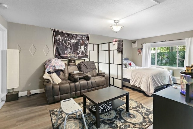 74 Beach St Unit 1-3, Woburn, MA 01801 - bedroom with a textured ceiling and wood finished floors