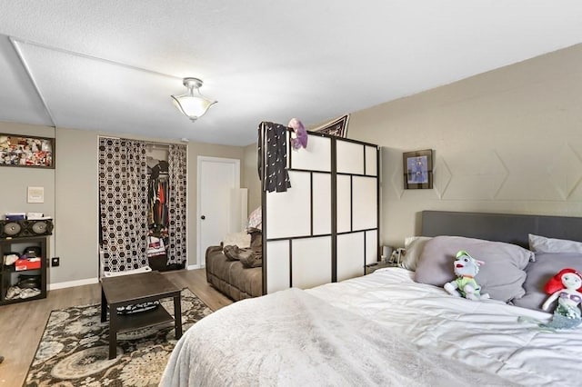 74 Beach St Unit 1-3, Woburn, MA 01801 - bedroom with wood finished floors and baseboards