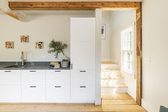 831 Main St, Dennis, MA 02638 - bar featuring a sink and light wood finished floors