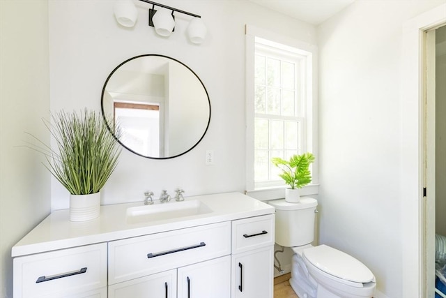 831 Main St, Dennis, MA 02638 - half bath featuring healthy amount of natural light, toilet, and vanity