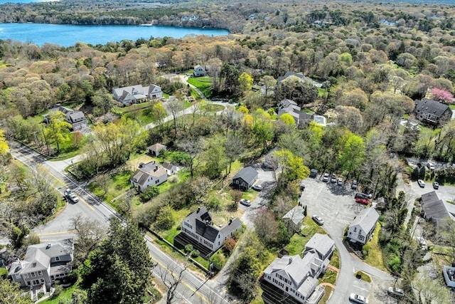 831 Main St, Dennis, MA 02638 - aerial overview of property's location featuring a large body of water, a heavily wooded area, and nearby suburban area