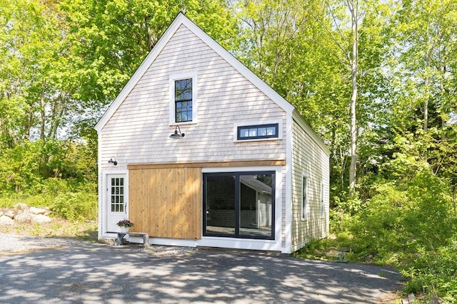 831 Main St, Dennis, MA 02638 - rear view of property with view of scattered trees