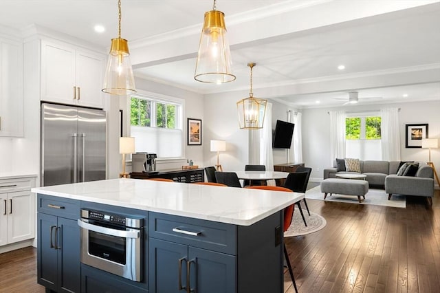 10 Fieldstone Way Unit 11, Wellesley, MA 02482 - kitchen with appliances with stainless steel finishes, plenty of natural light, white cabinetry, recessed lighting, and ornamental molding