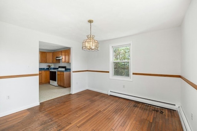 unfurnished dining area with a chandelier, light wood-style flooring, a baseboard radiator, and baseboards