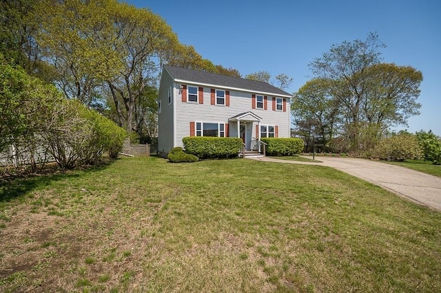 colonial home with concrete driveway