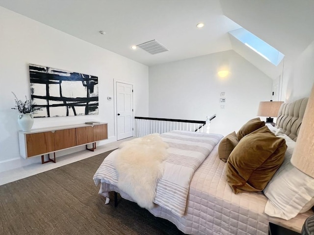 bedroom with a skylight, recessed lighting, baseboards, vaulted ceiling, and dark carpet