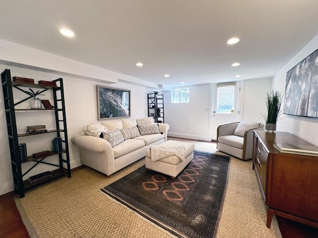 living area featuring recessed lighting and baseboards