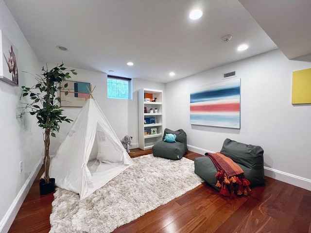 rec room featuring baseboards, wood finished floors, and recessed lighting