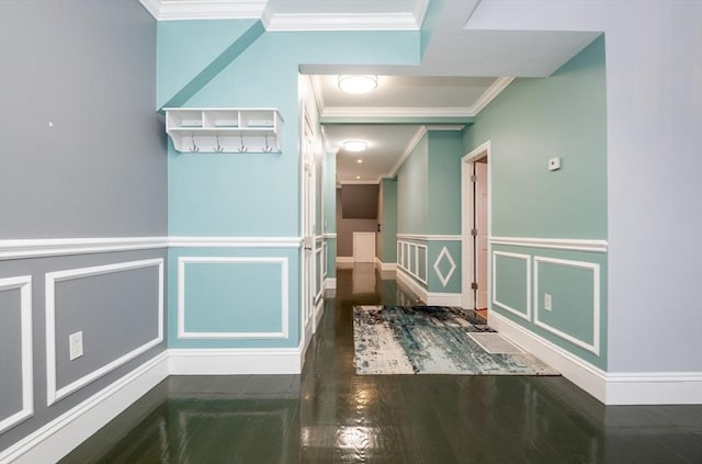 hall with ornamental molding and dark hardwood / wood-style floors