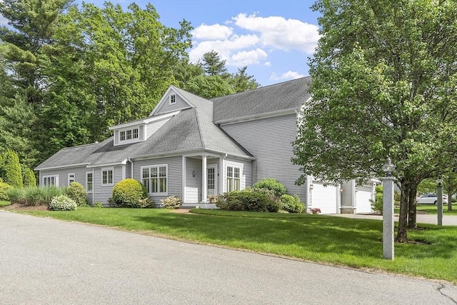 22 Hummock Way Unit 22, Hudson, MA 01749 - view of front of house with a front lawn, a shingled roof, and an attached garage