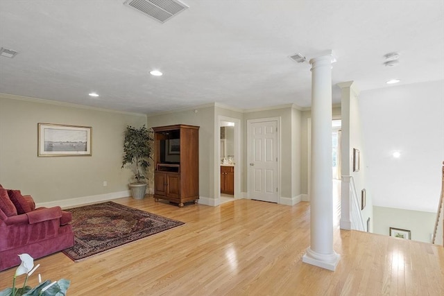 22 Hummock Way Unit 22, Hudson, MA 01749 - living room featuring decorative columns, light wood-type flooring, crown molding, baseboards, and recessed lighting
