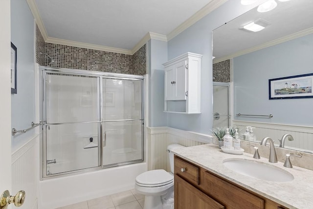 22 Hummock Way Unit 22, Hudson, MA 01749 - bathroom featuring a wainscoted wall, vanity, combined bath / shower with glass door, ornamental molding, and toilet