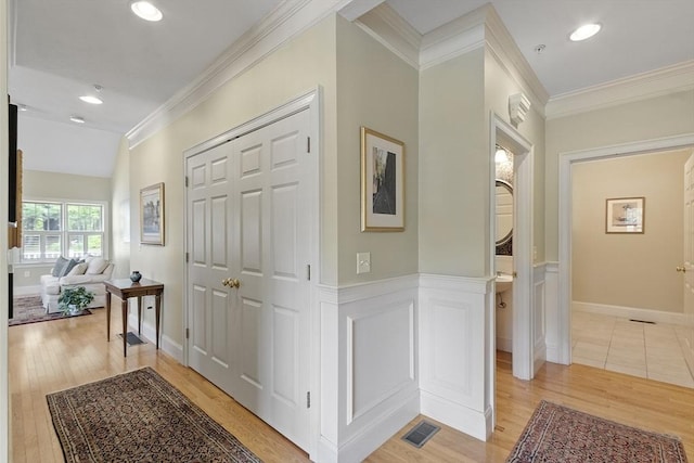 22 Hummock Way Unit 22, Hudson, MA 01749 - hall featuring crown molding, light wood-style flooring, recessed lighting, and wainscoting