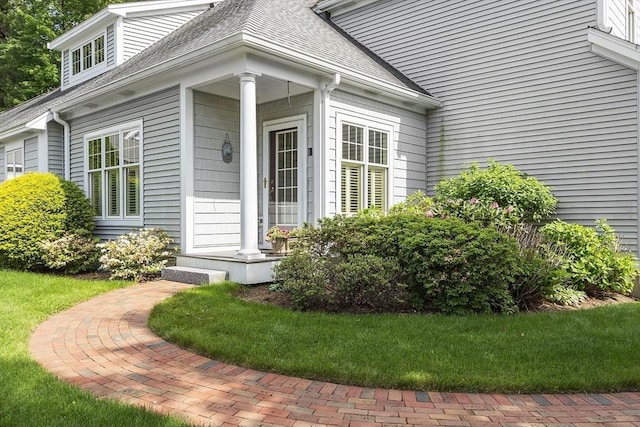 22 Hummock Way Unit 22, Hudson, MA 01749 - doorway to property featuring roof with shingles