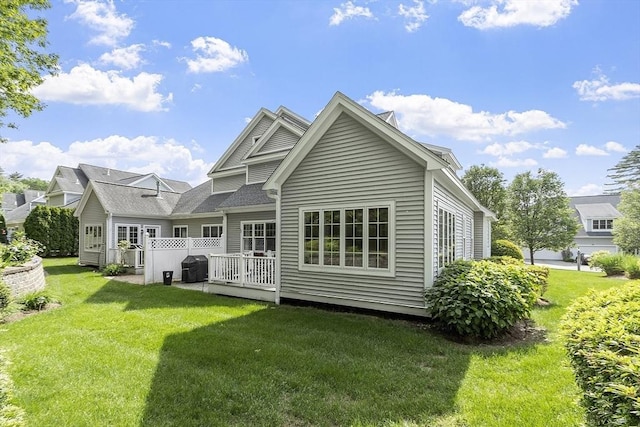 22 Hummock Way Unit 22, Hudson, MA 01749 - rear view of property featuring a lawn and a deck