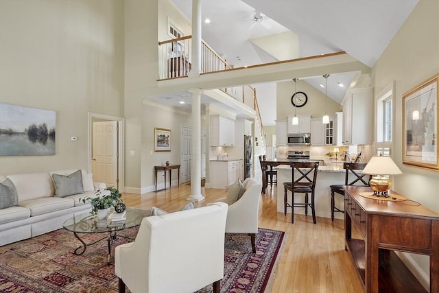 22 Hummock Way Unit 22, Hudson, MA 01749 - living room featuring high vaulted ceiling, light wood-type flooring, and a ceiling fan
