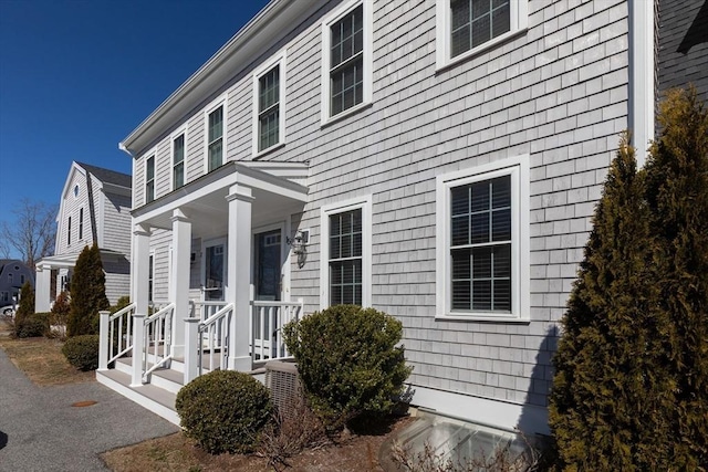 view of property exterior with covered porch