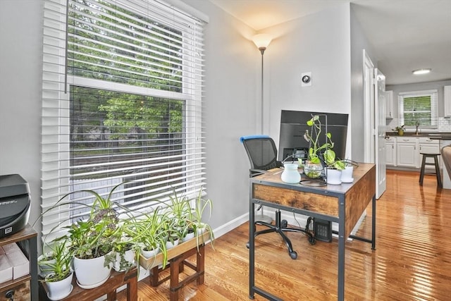 60 Mahogany Run Unit 60, Leominster, MA 01453 - home office featuring light wood-type flooring, baseboards, and a sink