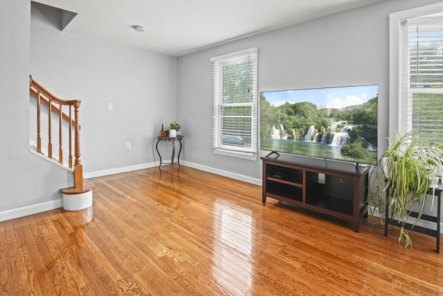 60 Mahogany Run Unit 60, Leominster, MA 01453 - unfurnished room with stairs, wood finished floors, and baseboards