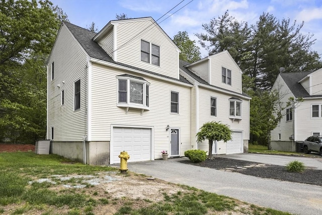 60 Mahogany Run Unit 60, Leominster, MA 01453 - view of front of property featuring asphalt driveway and an attached garage