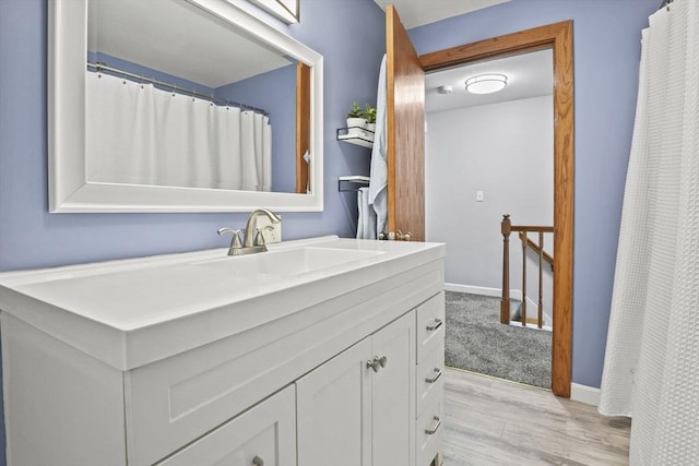 60 Mahogany Run Unit 60, Leominster, MA 01453 - bathroom with wood finished floors, vanity, and baseboards