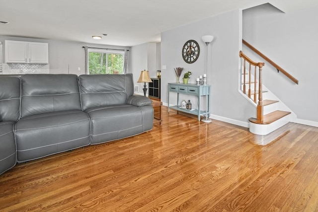 60 Mahogany Run Unit 60, Leominster, MA 01453 - living room with light wood-style flooring, stairs, and baseboards