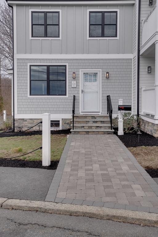 136 Flash Rd Townhome, Unit Townhome, Nahant, MA 01908 - view of front facade with board and batten siding and entry steps