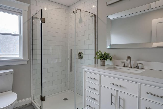 136 Flash Rd Townhome, Unit Townhome, Nahant, MA 01908 - bathroom with a shower stall, vanity, baseboards, and toilet