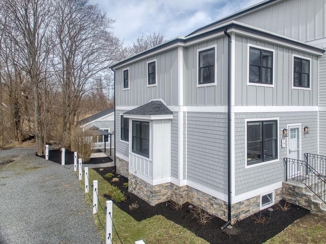 136 Flash Rd Townhome, Unit Townhome, Nahant, MA 01908 - view of property exterior featuring board and batten siding