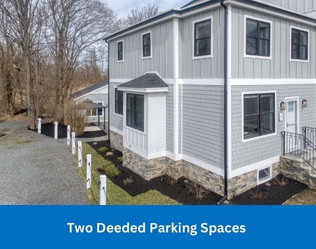 136 Flash Rd Townhome, Unit Townhome, Nahant, MA 01908 - view of side of property with board and batten siding