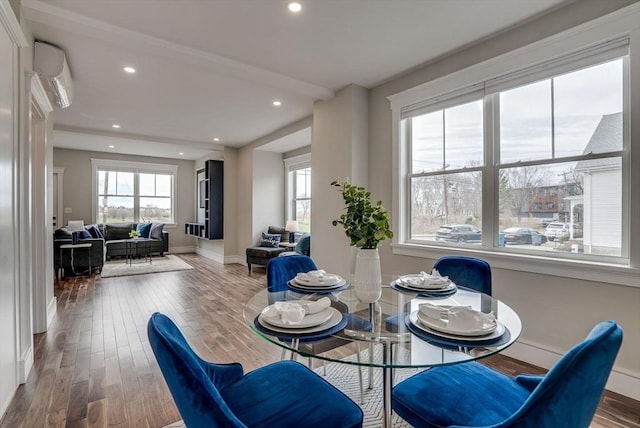 136 Flash Rd Townhome, Unit Townhome, Nahant, MA 01908 - dining space with recessed lighting, baseboards, a wall unit AC, and wood finished floors
