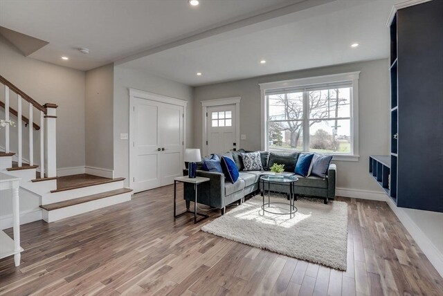 136 Flash Rd Townhome, Unit Townhome, Nahant, MA 01908 - living area with a healthy amount of sunlight, stairs, and wood finished floors