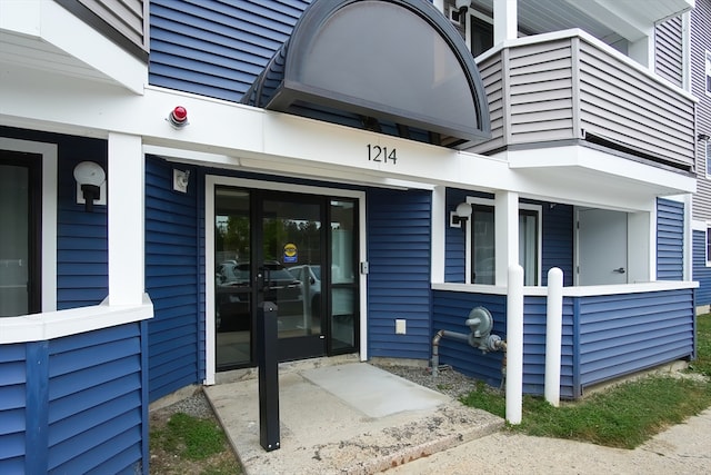 entrance to property with a balcony