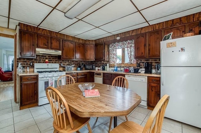 26 Hawthorne St, Brockton, MA 02301 - kitchen featuring white appliances, under cabinet range hood, light tile patterned floors, and light countertops
