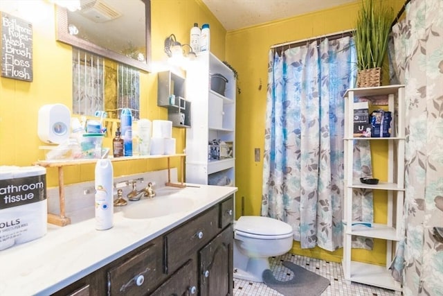 full bathroom with vanity, toilet, tile patterned floors, and curtained shower