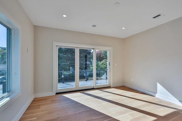 spare room with light wood-type flooring