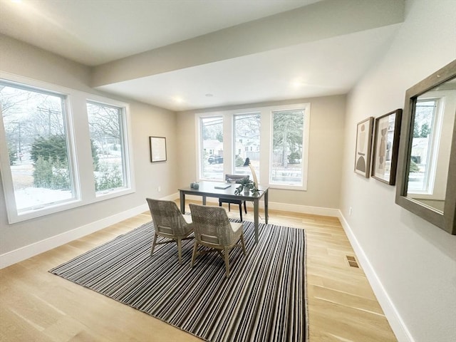 dining space featuring light wood-type flooring