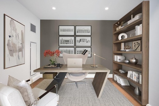 office area with hardwood / wood-style flooring