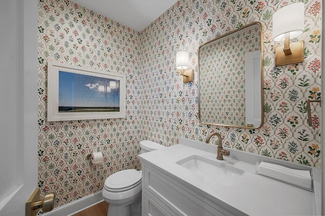 bathroom featuring hardwood / wood-style floors, vanity, and toilet