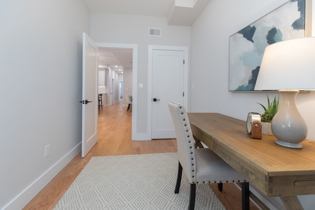 home office featuring light hardwood / wood-style flooring