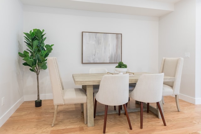 dining space with light wood-type flooring